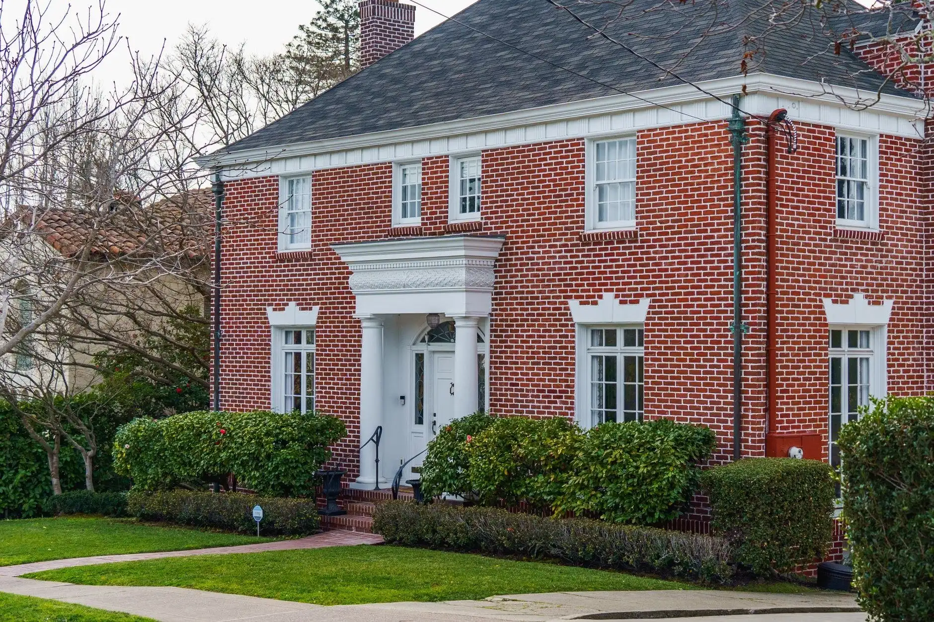Schaumburg Tuckpointing Pros crew restoring mortar joints on a residential brick wall